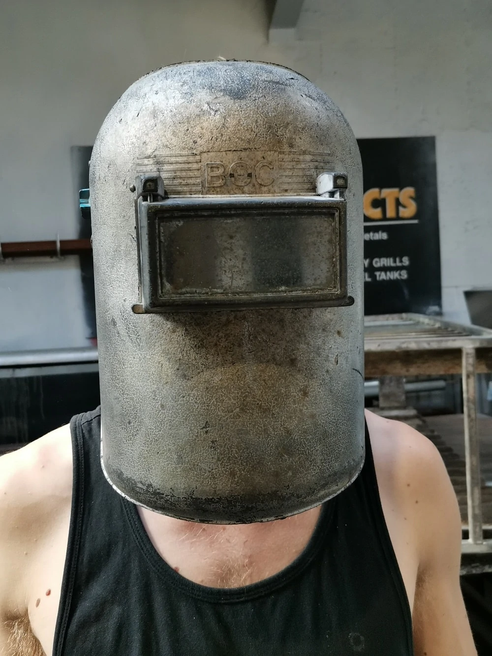 Wearing welding face sheild Wearing welding face sheild