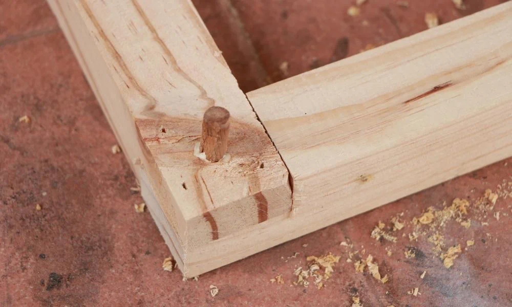 A dowel strengthening a wood joint by glue