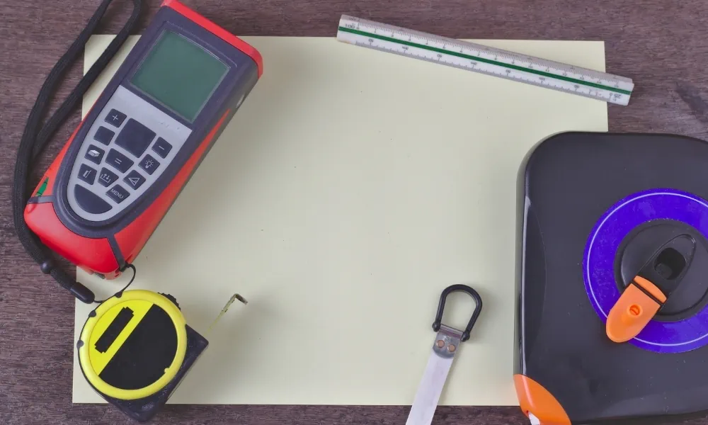 A laser measure and tape measure in one frame