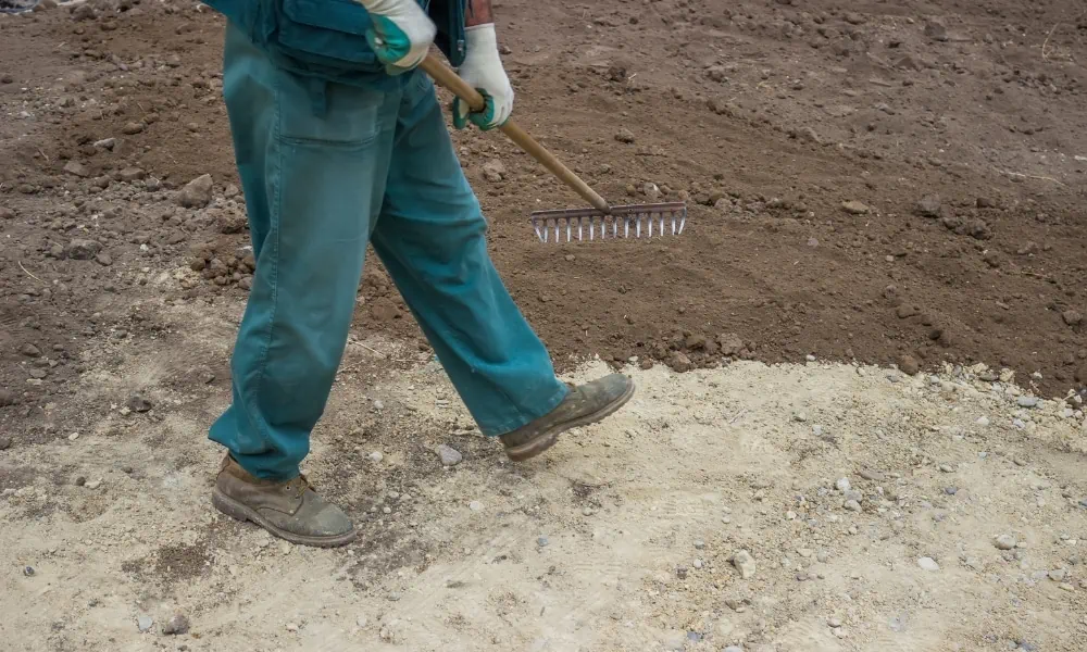 Leveling soil on the yard