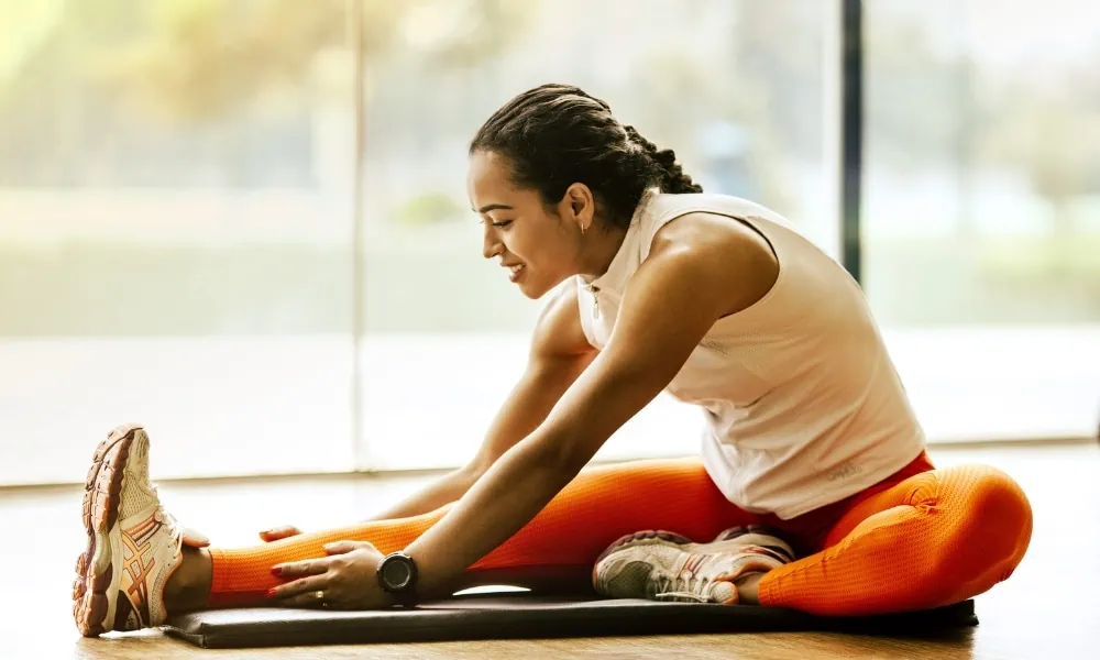 A female stretching feet to improve flexibility and mobility