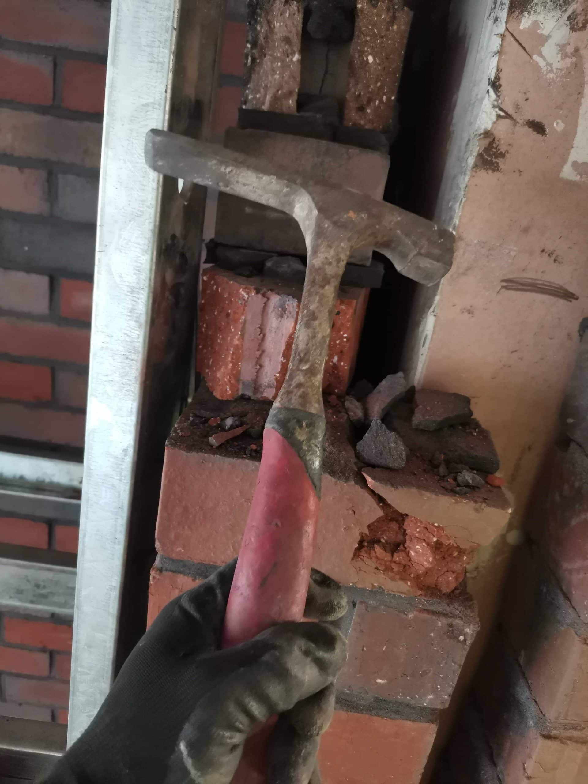 Me holding a brick hammer